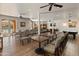 Inviting common area with seating, dining tables, a pool table and access to an outdoor pool at 14575 W Mountain View Blvd # 10313, Surprise, AZ 85374