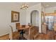 Charming dining area with wood floors and a round table and unique decor at 14575 W Mountain View Blvd # 10313, Surprise, AZ 85374