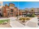 Community building with a charming archway, swimming pool, and pergola at 14575 W Mountain View Blvd # 10313, Surprise, AZ 85374