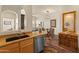 Modern kitchen with granite countertops, stainless steel appliances, and a breakfast bar with views to the living room at 14575 W Mountain View Blvd # 10313, Surprise, AZ 85374