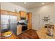 Kitchen with stainless appliances, granite countertops, and wood cabinetry at 14575 W Mountain View Blvd # 10313, Surprise, AZ 85374