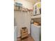 Functional utility room with appliances, storage, and shelving for convenience at 14575 W Mountain View Blvd # 10313, Surprise, AZ 85374