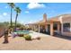Private backyard oasis with a sparkling pool, mature palms, and comfortable patio space at 14655 N Kings Way, Fountain Hills, AZ 85268