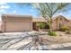 Inviting home with desert landscaping, rock accents, and a spacious two-car garage at 14655 N Kings Way, Fountain Hills, AZ 85268