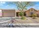 Charming single-story home featuring a well-manicured yard, xeriscaping, and a private two-car garage at 14655 N Kings Way, Fountain Hills, AZ 85268