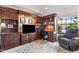 This home office features custom wood cabinets, shelves, desk, and large window for a bright and productive workspace at 14655 N Kings Way, Fountain Hills, AZ 85268