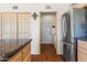 Bright kitchen area with stainless steel refrigerator and nearby laundry access at 14655 N Kings Way, Fountain Hills, AZ 85268