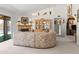 Spacious living room with a fireplace, built-in shelves, and sliding glass doors to the backyard at 14655 N Kings Way, Fountain Hills, AZ 85268