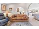 Bright and airy living room with arched doorways, neutral walls and carpet, perfect for relaxation and entertaining guests at 14655 N Kings Way, Fountain Hills, AZ 85268