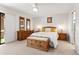 Bright main bedroom with a ceiling fan, wood furniture set, and neutral walls creating a peaceful retreat at 14655 N Kings Way, Fountain Hills, AZ 85268
