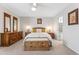 Bright main bedroom with a ceiling fan, wood furniture set, and neutral walls creating a peaceful retreat at 14655 N Kings Way, Fountain Hills, AZ 85268