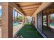 Inviting covered patio overlooks a tranquil pool, lush landscaping, and outdoor seating area at 14655 N Kings Way, Fountain Hills, AZ 85268