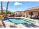Sparkling backyard pool with a small waterfall feature surrounded by patio space and desert landscaping at 14655 N Kings Way, Fountain Hills, AZ 85268