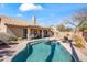 Beautiful pool area with well-maintained landscaping, a covered patio, and outdoor dining at 14655 N Kings Way, Fountain Hills, AZ 85268