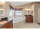 This primary bathroom features a garden tub, granite counters, and dual sinks at 15055 S 40Th Pl, Phoenix, AZ 85044