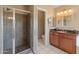 This primary bathroom features a tile shower and granite vanity at 15055 S 40Th Pl, Phoenix, AZ 85044