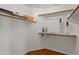 Bright walk-in closet with wood floor features ample shelving for optimized storage and organization at 15055 S 40Th Pl, Phoenix, AZ 85044