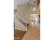 Bright foyer with a staircase, neutral walls, and tiled flooring leads to the home's living spaces at 15055 S 40Th Pl, Phoenix, AZ 85044