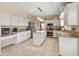 This kitchen features granite countertops, stainless steel appliances, and an island at 15055 S 40Th Pl, Phoenix, AZ 85044