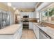 Stylish kitchen featuring an island, stainless appliances, and granite countertops at 15055 S 40Th Pl, Phoenix, AZ 85044
