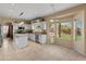 Spacious kitchen with white cabinets, stainless appliances, and island seating at 15055 S 40Th Pl, Phoenix, AZ 85044