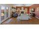 Well-lit living room featuring a fireplace, backyard access, and comfortable seating at 15055 S 40Th Pl, Phoenix, AZ 85044