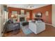 Comfortable living room with a fireplace, TV, and plush seating at 15055 S 40Th Pl, Phoenix, AZ 85044