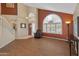 Spacious living room boasts high ceilings and a large arched window bringing in natural light at 15055 S 40Th Pl, Phoenix, AZ 85044