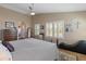 This primary bedroom features wood floors, neutral walls, and plantation shutters at 15055 S 40Th Pl, Phoenix, AZ 85044