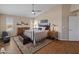 This primary bedroom features wood floors, neutral walls, and a ceiling fan at 15055 S 40Th Pl, Phoenix, AZ 85044