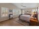 Bright main bedroom featuring vaulted ceilings, wood floors, plantation shutters, and cozy decor at 15055 S 40Th Pl, Phoenix, AZ 85044