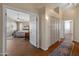 View of a spacious main bedroom with wood floors and doorway leading to hallway with built-in cabinets at 15055 S 40Th Pl, Phoenix, AZ 85044