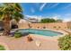 Backyard showcasing a refreshing in-ground pool, desert landscaping, and a privacy fence at 15055 S 40Th Pl, Phoenix, AZ 85044