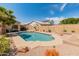 Backyard showcasing a refreshing in-ground pool, desert landscaping, and a privacy fence at 15055 S 40Th Pl, Phoenix, AZ 85044