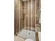 Modern shower with glass door, built-in bench, mosaic tile, and rainfall showerhead at 1506 E Tuckey Ln, Phoenix, AZ 85014
