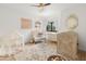 Cozy Bedroom decorated with soft colors, a comfortable chair, and a whimsical play area at 1506 E Tuckey Ln, Phoenix, AZ 85014