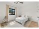 Serene bedroom with hardwood floors, neutral tones, and a comfortable bed setup for relaxation at 1506 E Tuckey Ln, Phoenix, AZ 85014