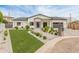 Beautiful single-story home features manicured landscaping, brick driveway, and inviting modern curb appeal at 1506 E Tuckey Ln, Phoenix, AZ 85014