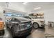 Clean and organized two-car garage with ample storage space and epoxy flooring at 1506 E Tuckey Ln, Phoenix, AZ 85014