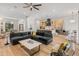 Bright, open-concept living area flows into kitchen, featuring hardwood floors, comfortable seating, and modern design elements at 1506 E Tuckey Ln, Phoenix, AZ 85014