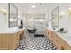 A luxurious main bathroom boasts a soaking tub, dual vanities, and a walk-in shower for ultimate relaxation at 1506 E Tuckey Ln, Phoenix, AZ 85014