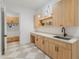 Well-organized mudroom featuring custom cabinets, a convenient bench, and stylish flooring at 1506 E Tuckey Ln, Phoenix, AZ 85014