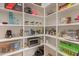 A well-organized pantry with shelves stocked with various food items and household supplies at 1506 E Tuckey Ln, Phoenix, AZ 85014