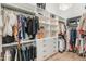 Well-organized walk-in closet with ample hanging space and shelving, providing efficient storage solutions at 1506 E Tuckey Ln, Phoenix, AZ 85014