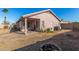 Expansive backyard featuring a covered patio, firepit, mature landscaping, and ample room for recreation at 16150 N 86Th Ave, Peoria, AZ 85382