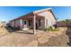 Inviting backyard with covered patio, stone pathway, mature plants and ample space for outdoor enjoyment at 16150 N 86Th Ave, Peoria, AZ 85382