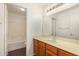 Bathroom featuring a wooden vanity and shower-tub combo at 16150 N 86Th Ave, Peoria, AZ 85382