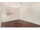 Spacious bedroom with wood floors, a ceiling fan and a window at 16150 N 86Th Ave, Peoria, AZ 85382