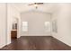 Primary bedroom featuring dark wood floors, high ceilings, and lots of natural light at 16150 N 86Th Ave, Peoria, AZ 85382