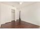 Bedroom featuring wood floors and a closet with sliding doors at 16150 N 86Th Ave, Peoria, AZ 85382
